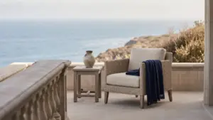 An elegant but understated coastal villa terrace with simple furniture