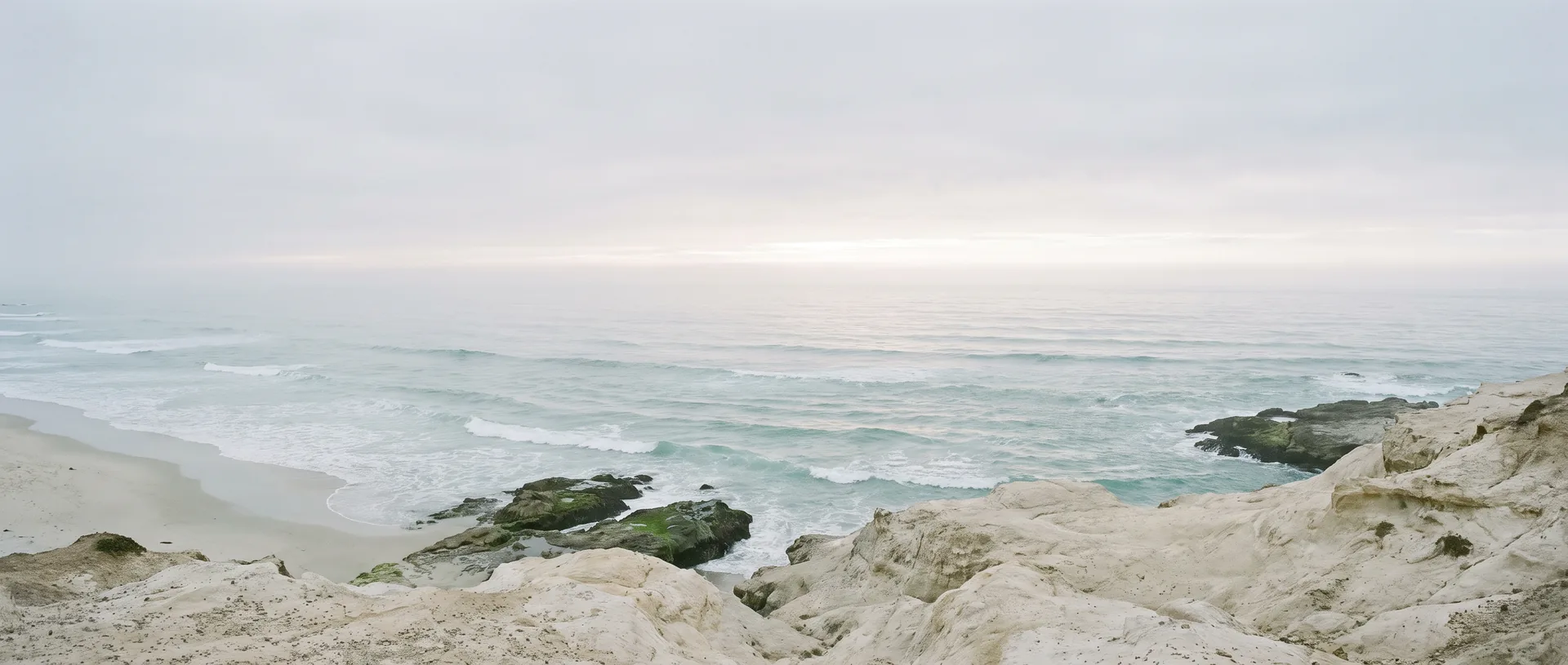 The Pacific coastline on a calm, overcast morning
